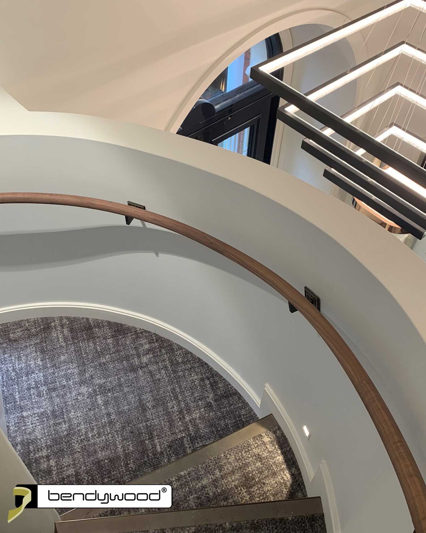 Bending handrails ø40mm in Bendywood® American walnut for curved staircase