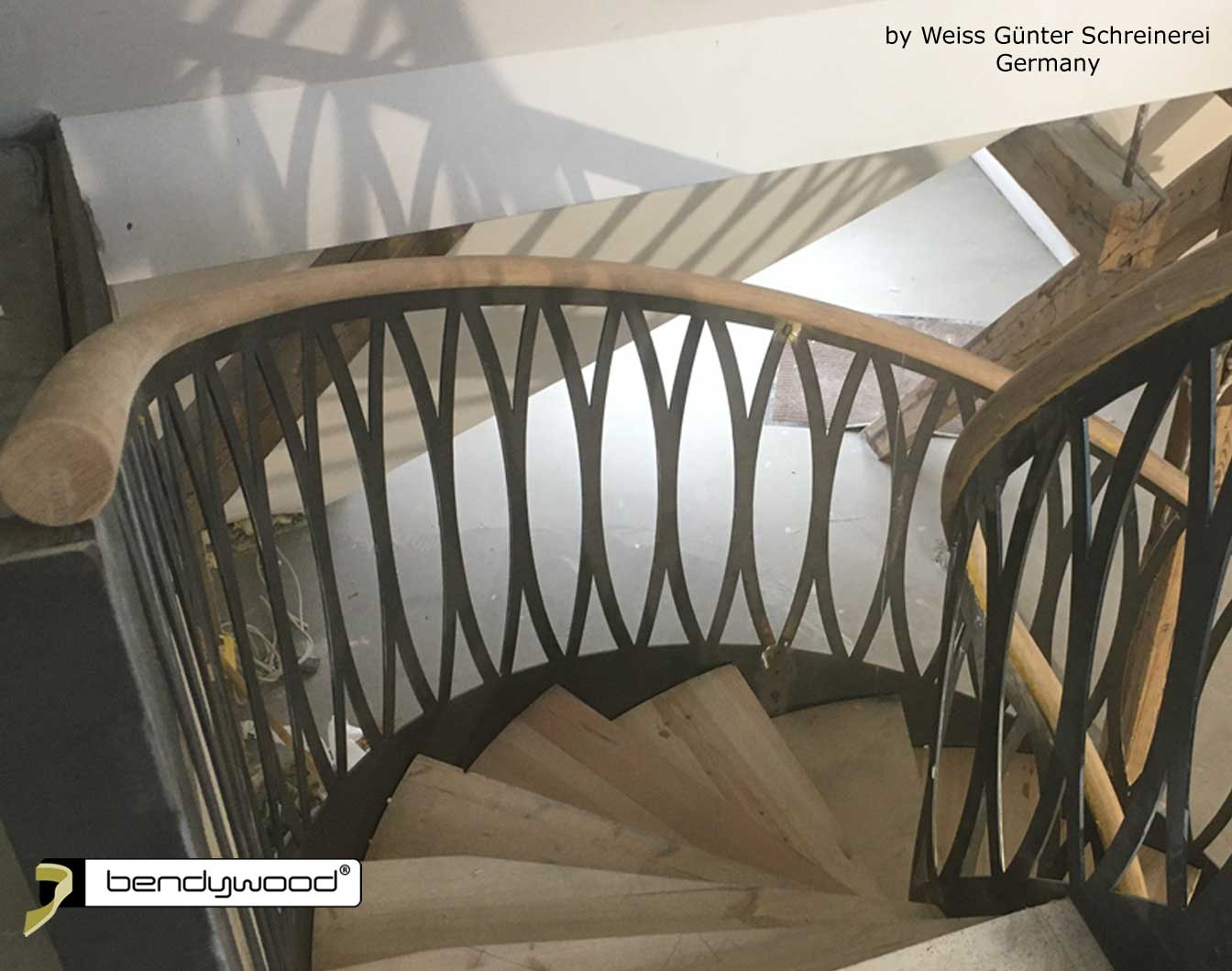 Bending wood Bendywood® - curved staircase with bending handrail in oak, mounted on steel stair stringer
